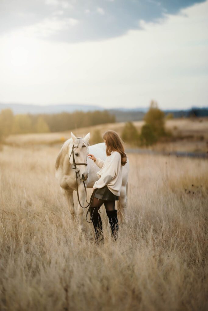 Equestrian photo session with a white horse and rider near Vancouver Washington