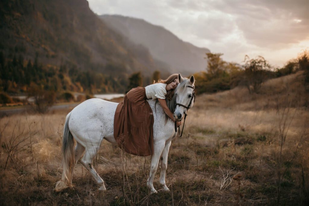 Equestrian photo session with a white horse and rider near Vancouver Washington