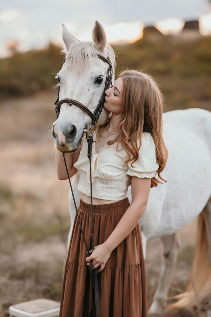 Equestrian photo session with a white horse and rider near Vancouver Washington